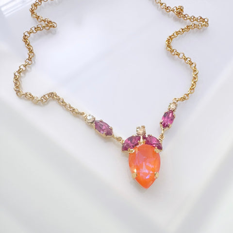 Notify me: Gouden kettinkje met oranje en fuchsia kristalletjes