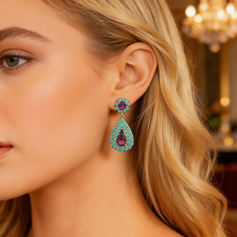 Notify me: Oorstekers met wit opaal druppels omringd door turquoise steentjes