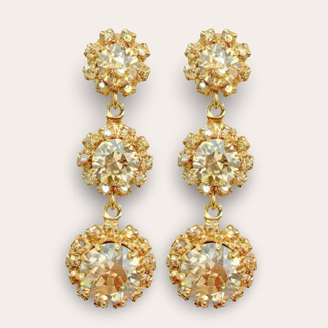 Gouden bloemen oorhangers met Swarovski kristallen