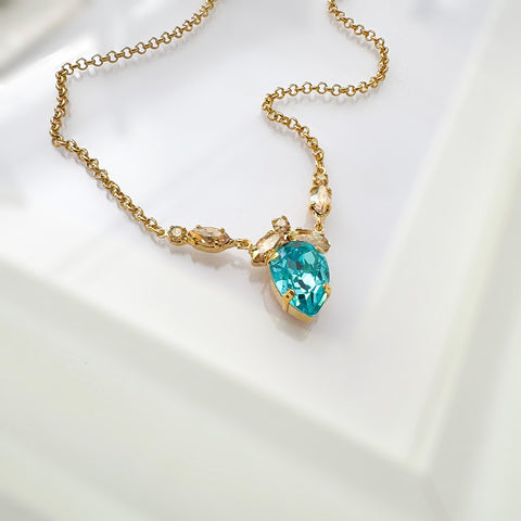 Earrings with leaves and a turquoise Swarovski drop