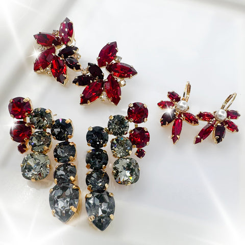 Earrings with flowers of red crystals and a pearl